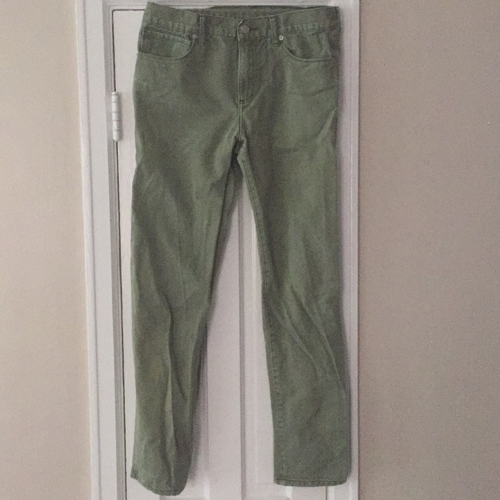 Green denim pants.